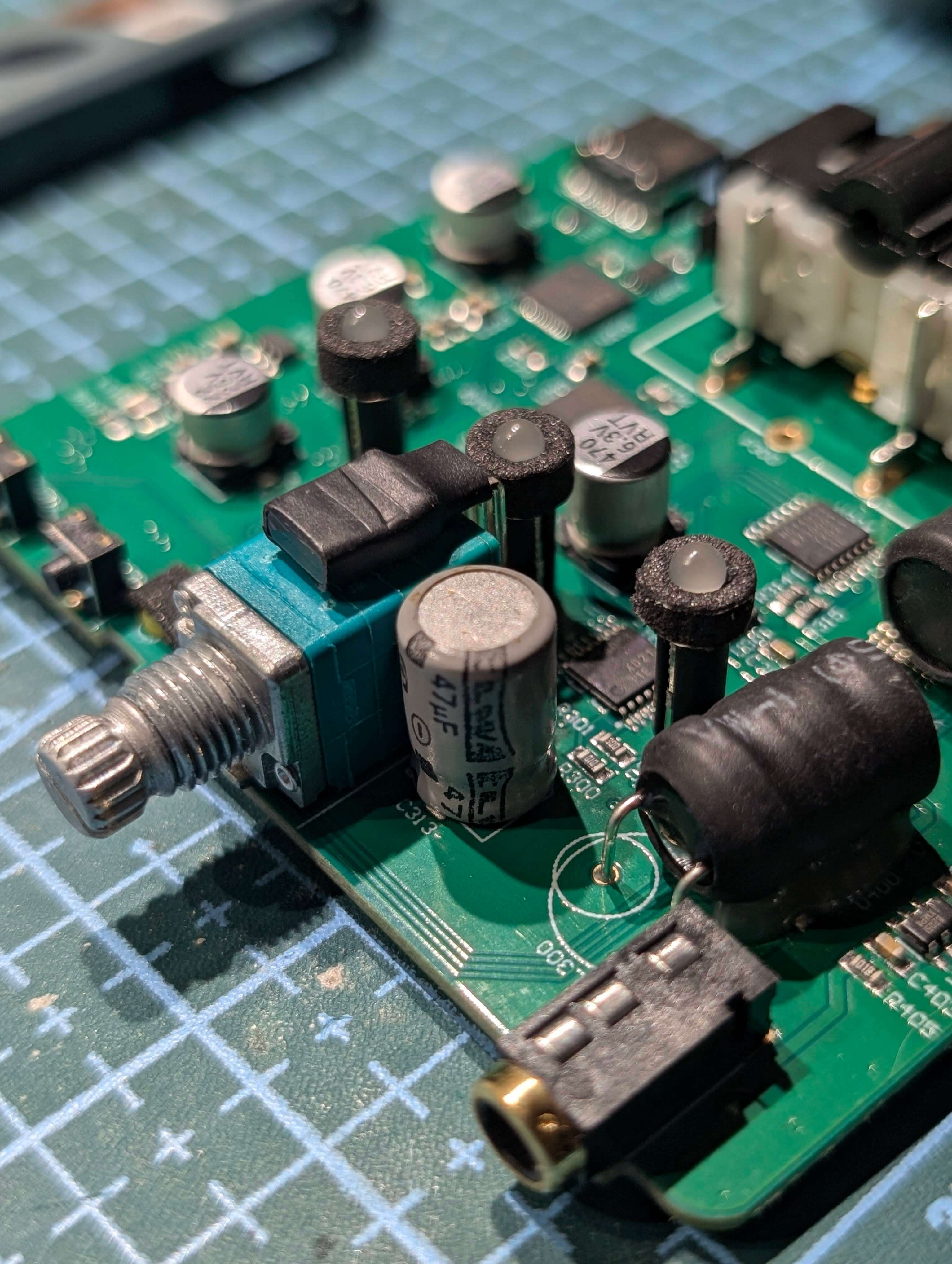 Close-up of the board with a capacitor soldered
